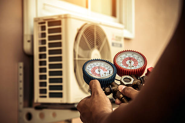 Professional Hvac technician working in Mc Dade, TX
